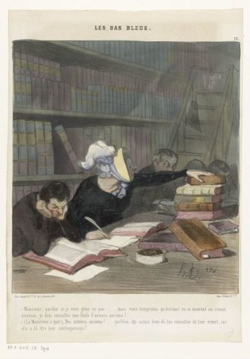 Figures behind a reading table in a public library