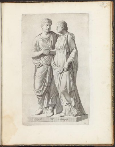 Statue of a man and a woman shaking hands