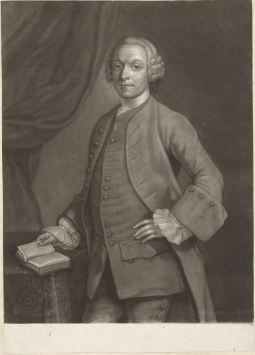 Portrait of an unknown man standing with a book in his hand