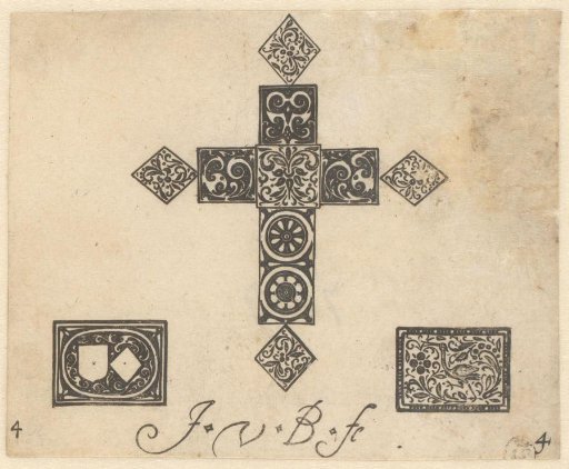 Three small black ornaments with scrolls