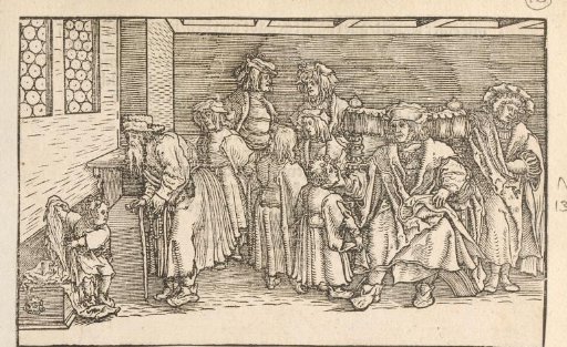 Father in a large chair surrounded by family