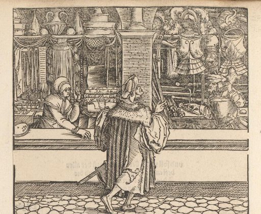 Man walking past a textile shop towards an arms dealer