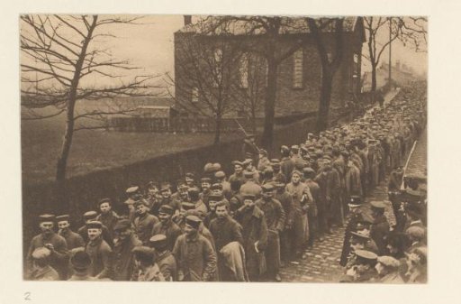 The battles of Neuve-Chapelle (9-13 March 1915) in Flanders were a great success for the English army (...) Prisoners of war, happily out of danger, walking through a village in England