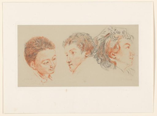 Two boys' heads and a girl's head