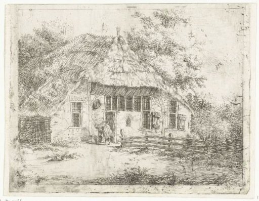 Woman bent over a basket in front of a house in Staphorst