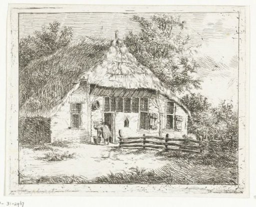 Woman bent over a basket in front of a house in Staphorst