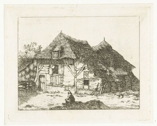 Man sitting on a small hill in front of a house in Staphorst
