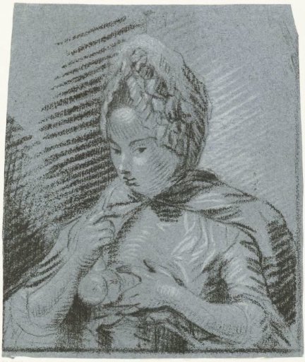 Young mother feeds her child with a feeding bottle