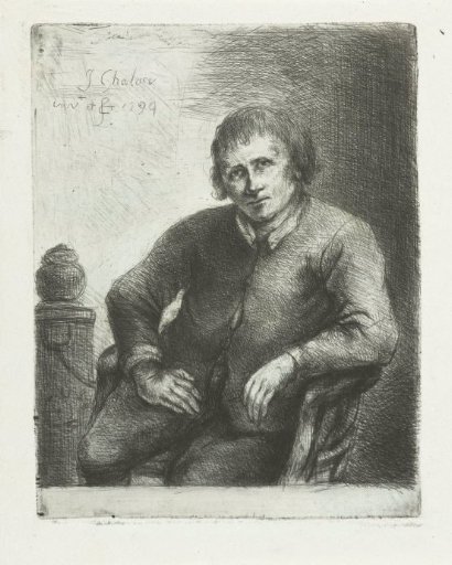 Seated man next to a pillar