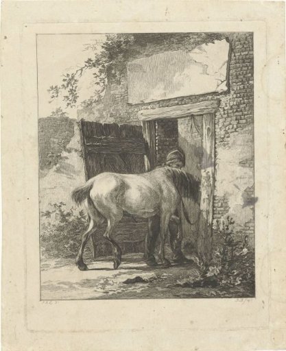 A stable boy leading a horse into the stable