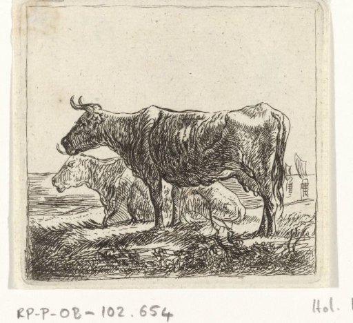 Two cows on a riverbank