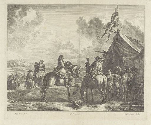 Soldiers at a tent with a flag, pul, and wreath