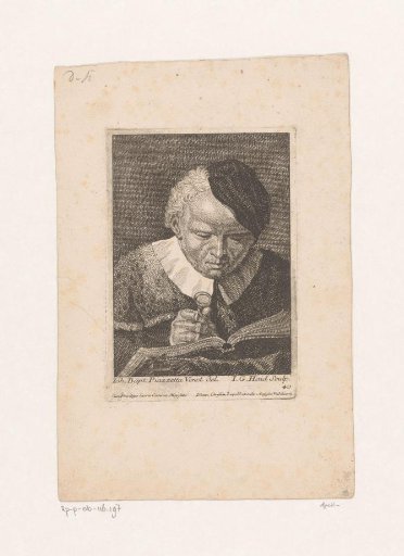 Man reading with a magnifying glass