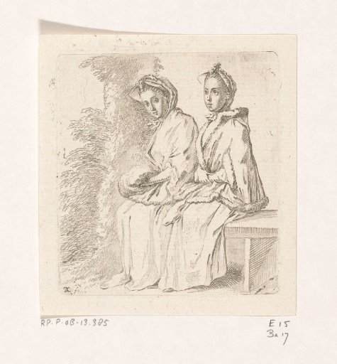 Two ladies sitting by a tree