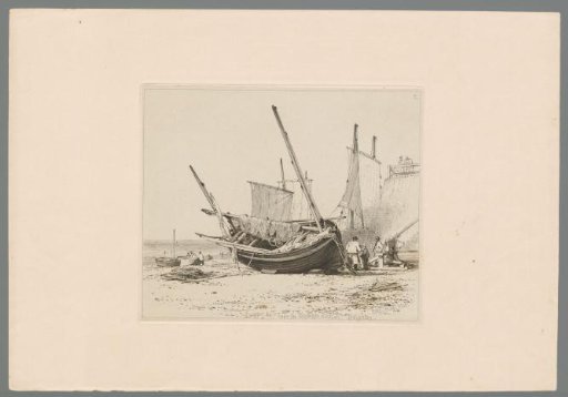 Lugger with two masts lying on the beach of Brighton