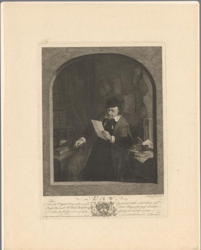 Man in an office surrounded by papers