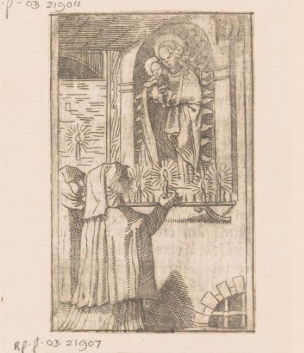 Two women lighting candles before an image of the Madonna