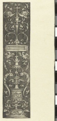 Ornament with a vase and two helmets