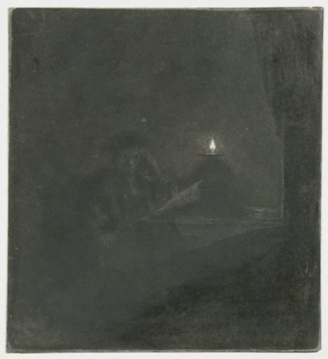 Student at a table by candlelight