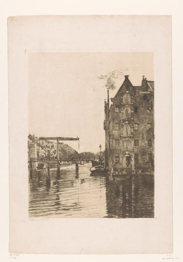 View of warehouses along the water and a lift bridge