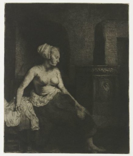 Woman seated with bare upper body beside a stove