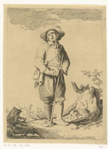 Standing man with staff in a landscape