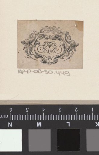 Vignette with a monogram in an ornamental frame