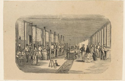 Interior of a workshop with dozens of men at work