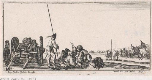 Soldiers playing cards next to a cannon