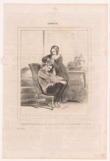 Young woman fastening paper curlers in a young man's hair