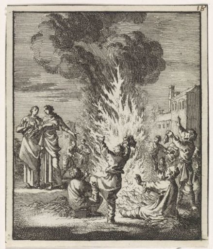 Children dancing around a blazing straw fire