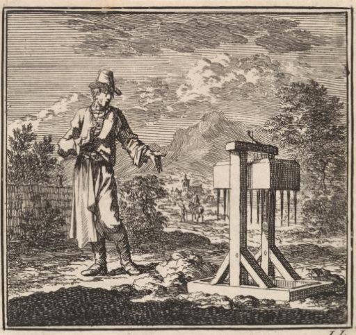 Man pointing at a mole trap