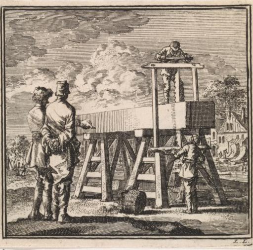Two men watch as a large beam is sawn through