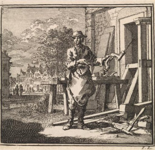 Carpenter pointing to the drill he holds in his hand
