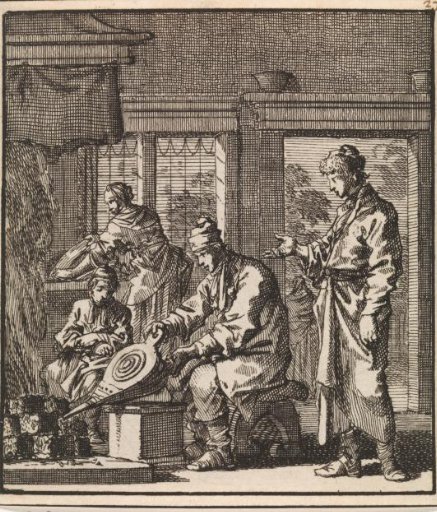 Man stoking the fire with a bellows