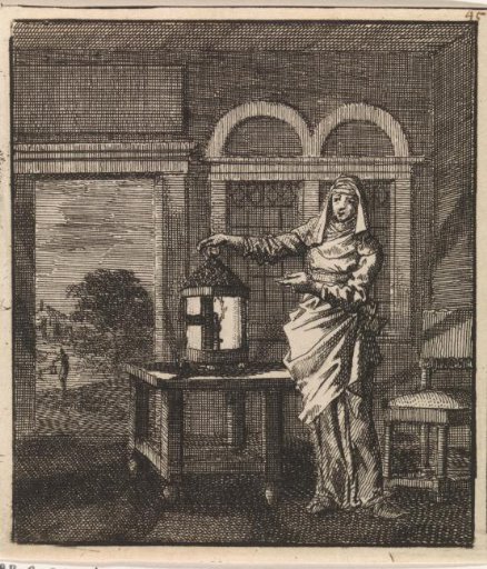 Woman placing a lit lantern on a table