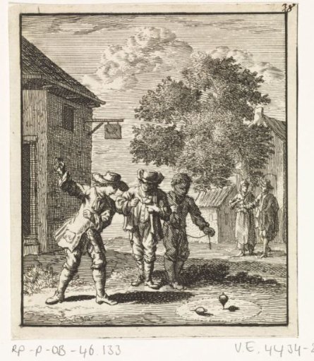 Children playing with spinning tops