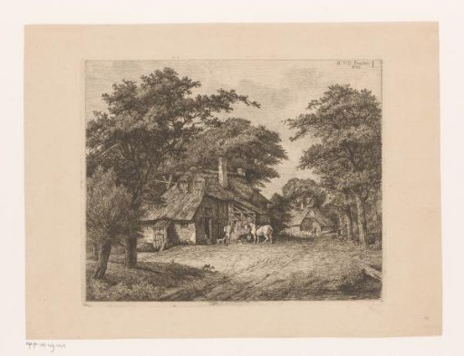 White horse at a manger in front of a farm