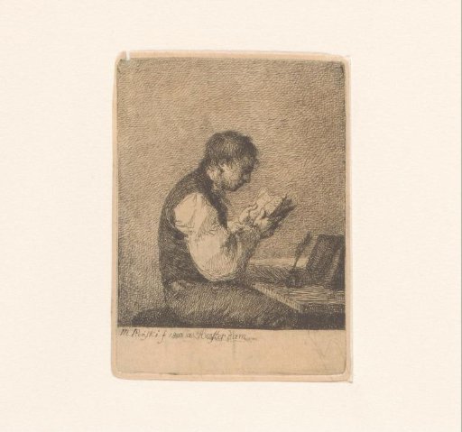 Man reading at a desk