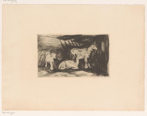 Three goats in a barn