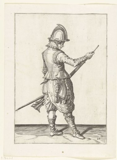 Soldier pushing powder and ball into the barrel of his musket with his ramrod