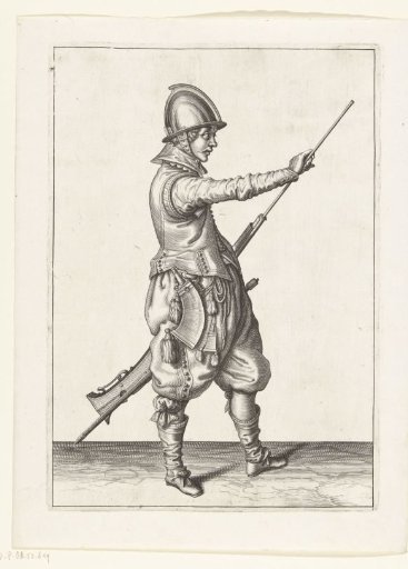 Soldier drawing his ramrod from the barrel of his musket