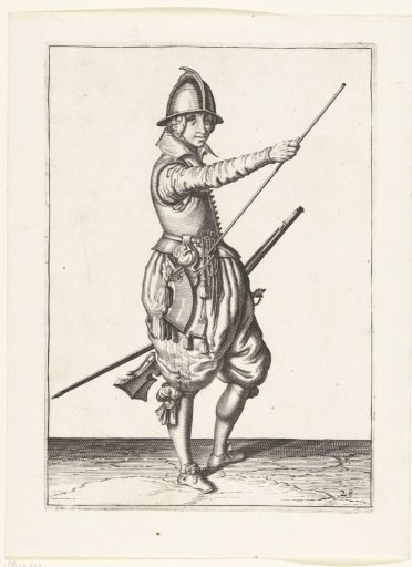 Soldier with a musket sliding his right hand to the end of his ramrod
