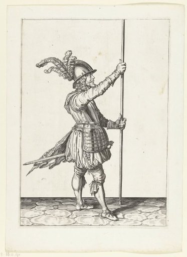 Soldier, turned to the left, holding his spear upright with both hands in front of him slightly above the ground