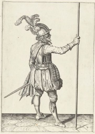 Soldier, seen from behind, holding his spear upright with his right hand