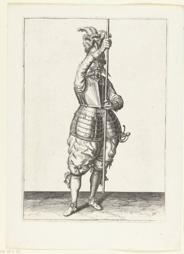 Soldier, seen from the front, holding his spear upright with both hands in front of him slightly above the ground