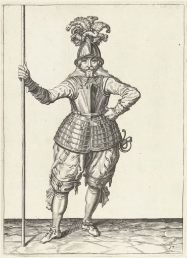 Soldier, seen from the front, holding his spear upright with his right hand