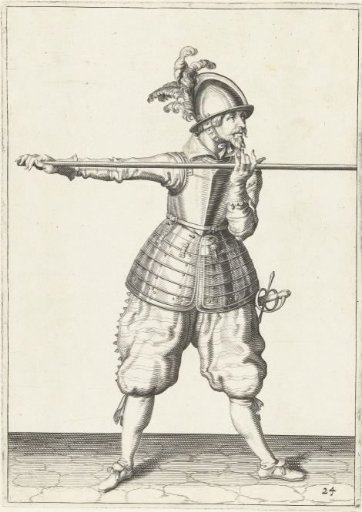 Soldier carrying his spear horizontally at shoulder height with both hands, his right hand at the butt of the weapon