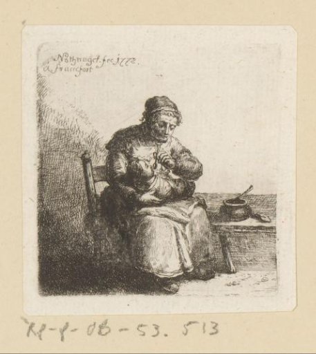 Woman holding swaddled child on her lap