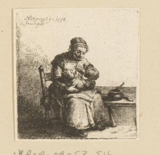 Woman holding swaddled child on her lap